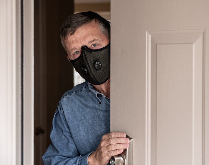 Man is waring the mask at home